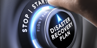 Image depicting a company activating their disaster recovery plan with a switch.